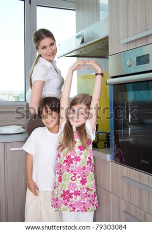 happy young family preparing lunchin the kitchen