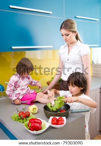 happy young family preparing lunchin the kitchen