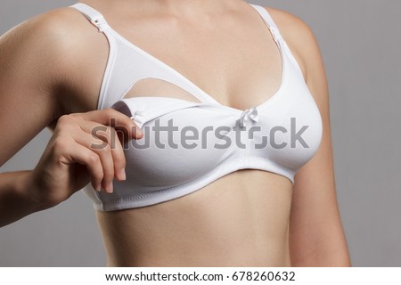 Nursing bra for mothers. moms bra with new disposable breast pad. Prevents the flow of milk on the clothes, it is convenient to unfasten the cups for feeding the baby.