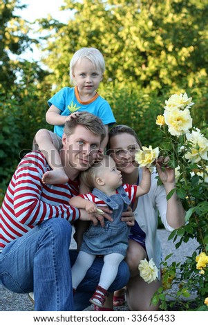 Happy family in the rose garden