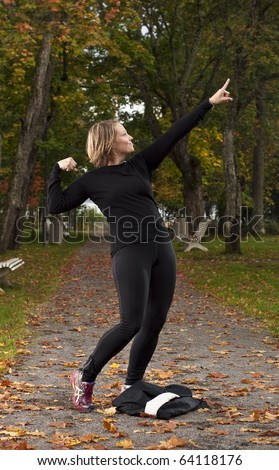 Attractive female athlete doing a victory pose.
