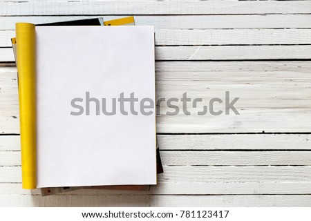 Magazine page mock up catalog opened on a white wooden background. Top view. Copy space