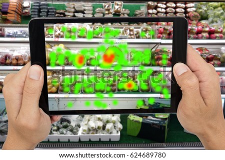 internet of things marketing concepts,man holding tablet to know the data of eye contract of customer by augmented reality technology,to collect and analysis data that customer like and wish to buy