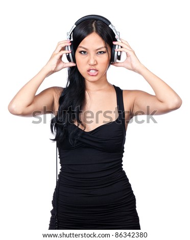 A young girl listening to music making a mean face.