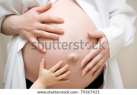 The young family expecting a birth of the child