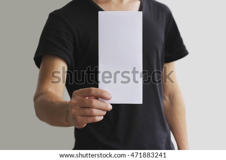 Man showing blank white flyer brochure booklet. Leaflet presentation. Pamphlet hold hands. Man show clear offset paper. Sheet template. Booklet design sheet display read first person