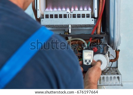 Repair of a gas boiler, setting up and servicing by a service department. Adjustment of gas pressure by manometer