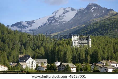 hotel building in mountain resort davos switzerland with impressive peak and glacier in background