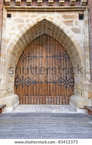 Wooden door at castle entrance in Krakow Poland