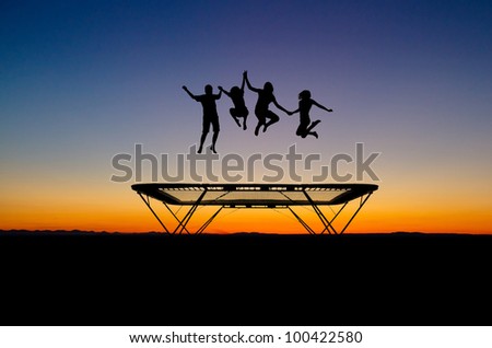 silhouette of kids on trampoline