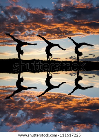 silhouette of gymnasts in sunset at beach