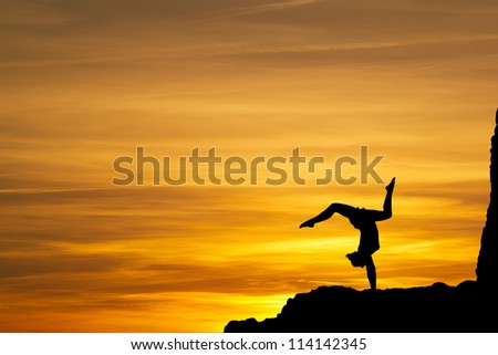 gymnast in sunset
