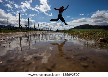 man jumps in black forest
