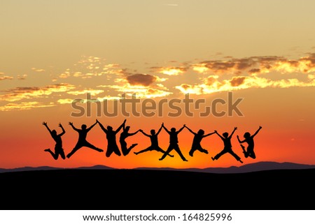 friends jumping in sunset sky