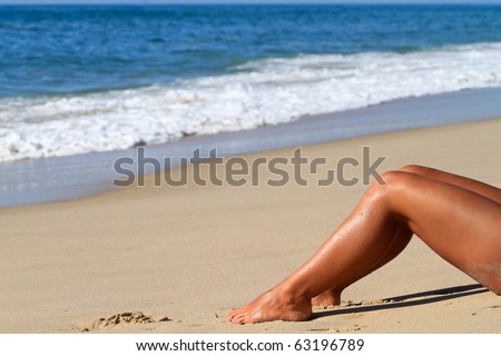nice female legs on beach