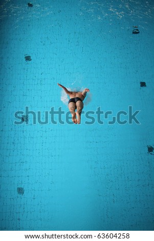 man diving in pool