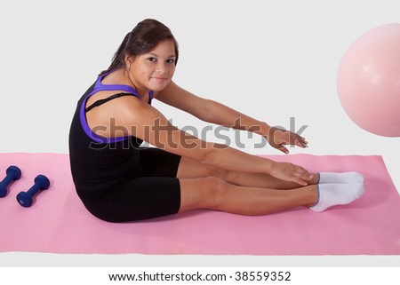 stock photo Young brunette aboriginal teen girl wearing workout attire 