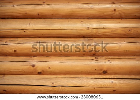 Wooden log wall of a sauna house textured
