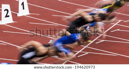 sprint start in track and field in blured motion