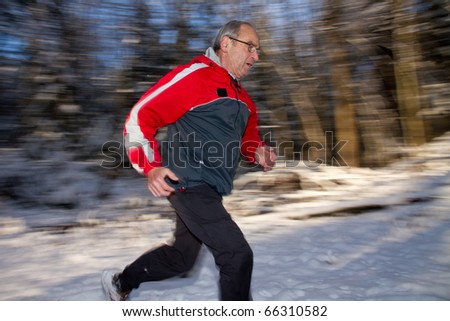 senior jogging in the snow