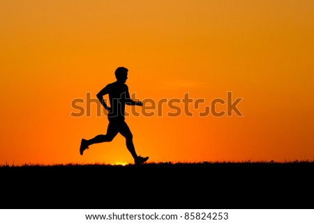 silhouette of a jogger in sunrise