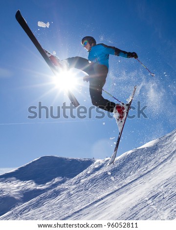 skier in a jump in backlight