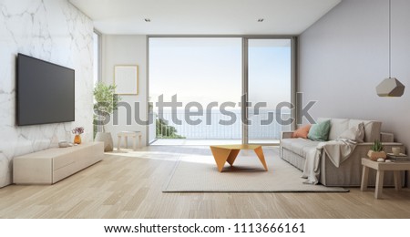Sea view living room of luxury beach house with glass door and wooden terrace. TV on white marble wall against sofa near indoor plant in vacation home or holiday villa. Hotel interior 3d illustration.