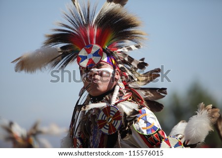 SAN BERNARDINO, CALIFORNIA, USA, OCTOBER 13, 2012.  The San Manuel Band of Indians hold their annual Pow Wow in San Bernardino on October 13, 2012. A tribal warrior wearing a Fancy Dancer head dress.