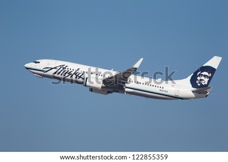 LOS ANGELES, CALIFORNIA, USA - DECEMBER 11 : Alaska Airlines Boeing 737-990 takes off from Los Angeles International Airport on December 11, 2012.  The plane has a speed of 588 mph.