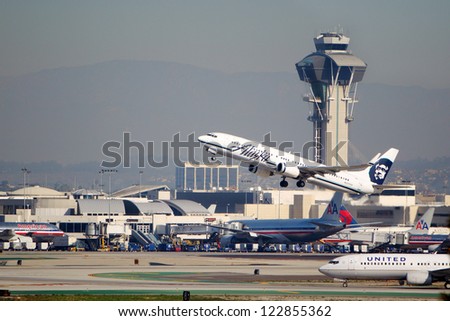 LOS ANGELES, CALIFORNIA, USA - DECEMBER 11: Alaska Airlines Boeing 737-990 takes off from Los Angeles International Airport on December 11, 2012.  The plane has a speed of 588 mph.