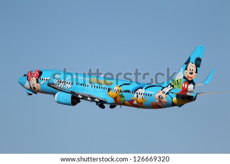 Los Angeles, California, Usa - January 28: An Alaska Airlines Spirit Of Disneyland 737-400 Takes Off From Los Angeles Airport On January 28, 2013. It Has A Range Of 2,370 Miles And 144 Seats.