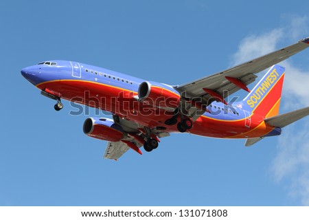 LOS ANGELES, CALIFORNIA, USA - MARCH 8, 2013. Southwest Airlines Boeing 737-7H4 lands at Los Angeles Airport on March 8, 2013. The plane has a range of 6,340 miles with 177 seats.
