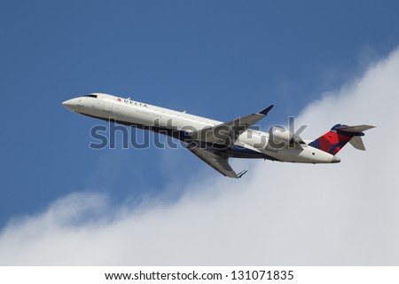 LOS ANGELES, CALIFORNIA, USA - MARCH 8, 2013 - Delta Connection Bombardier CRJ-701 takes off from Los Angeles Airport on March 8, 2013. The plane has a range of 2,656 km with 66 seats.