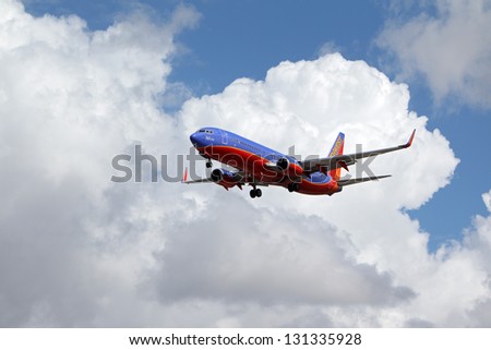 LOS ANGELES, CALIFORNIA, USA - MARCH 8, : Southwest Airlines Warrior One 737-800 lands at Los Angeles Airport on  March 8, 2013. The plane seats 126 passengers with a range of 10,200 km