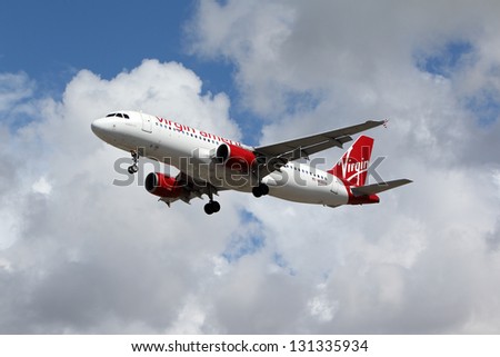 LOS ANGELES, CALIFORNIA, USA - MARCH 8, :Virgin America Airbus A320-214 lands at Los Angeles Airport on March 8, 2013. The plane has a range of 5,900 km with 150 seats.
