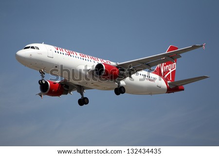 LOS ANGELES, CALIFORNIA, USA - MARCH 21, 2013 - Virgin America Airbus A320-214 lands at Los Angeles Airport on March 21, 2013. The plane has a range of 5,900 km with 150 seats.