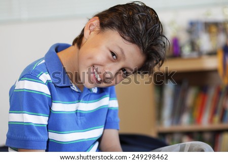 Smiling young boy with hair gel - with shallow depth of field