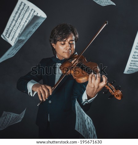 Musician plays the violin and music sheets flying around