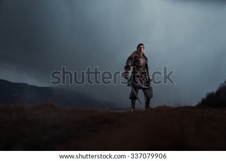 Medieval knight with sword in armor as style Game of Thrones in Winter Landscapes