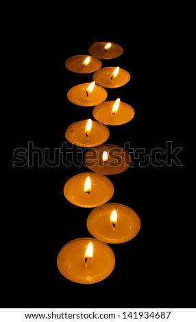 luminous zigzag from candle isolated on black background