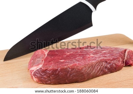 Preparation for cutting a piece of beef isolated on white background