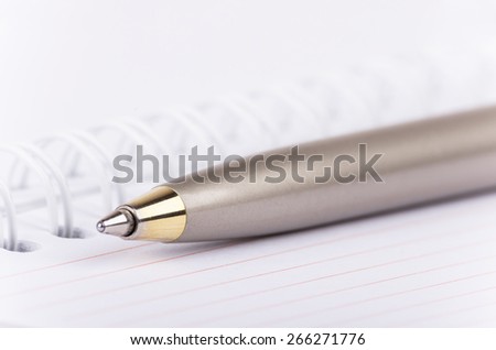 Blank notebook and ball pen with small depth of field
