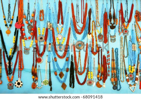 colorful traditional vintage necklace on blue background