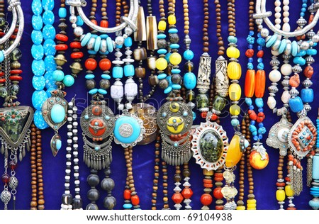 set of colorful traditional vintage necklace on blue back ground
