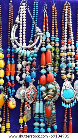 et of colorful traditional vintage necklace on blue back ground