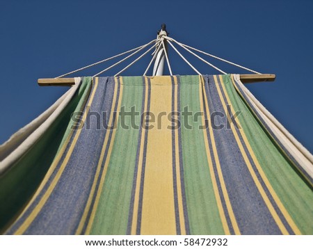 Striped hammock watching the blue sky during a summer day