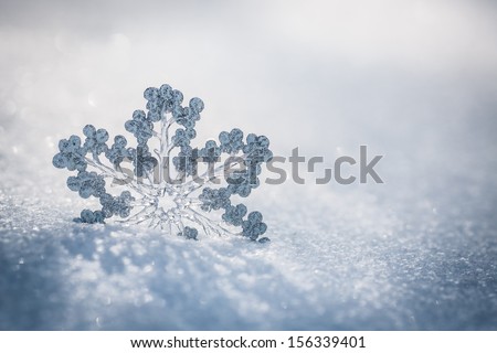 Silver Christmas decoration Beautiful snowflake on real snow outdoors Winter holidays concept Silver Christmas decoration Beautiful snowflake on real snow outdoors Winter holidays concept