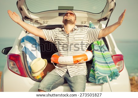 Man on vacation. Summer holiday and car travel concept