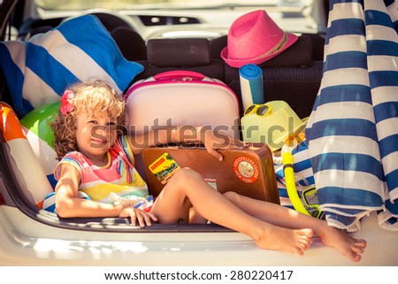 Child going on summer vacation. Car travel concept