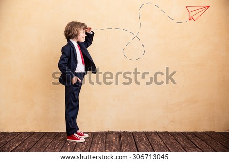 Portrait of young businessman with drawn airplane. Success, creative and start up concept. Copy space for your text